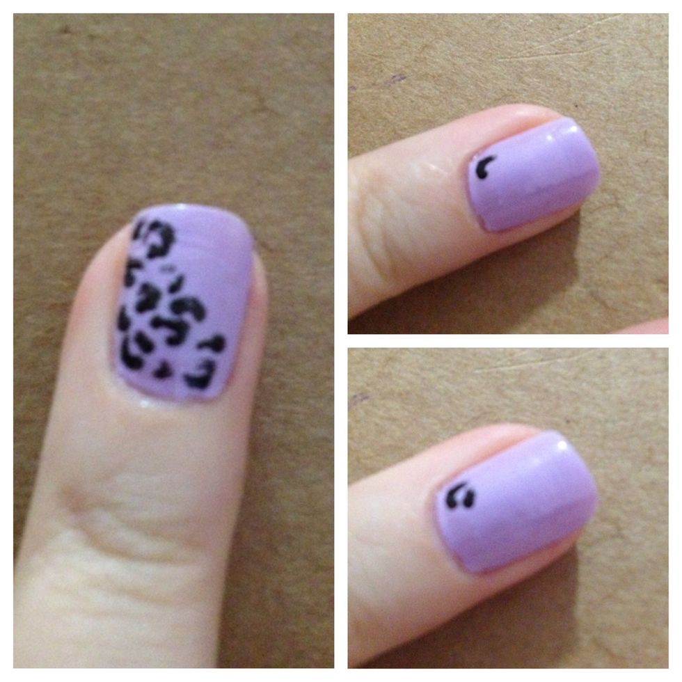 Step 3: Create a cheetah print on nail by using dotting tool to creat curved lines and c shapes on ring fingers! I used a black nail polish by LA Colors