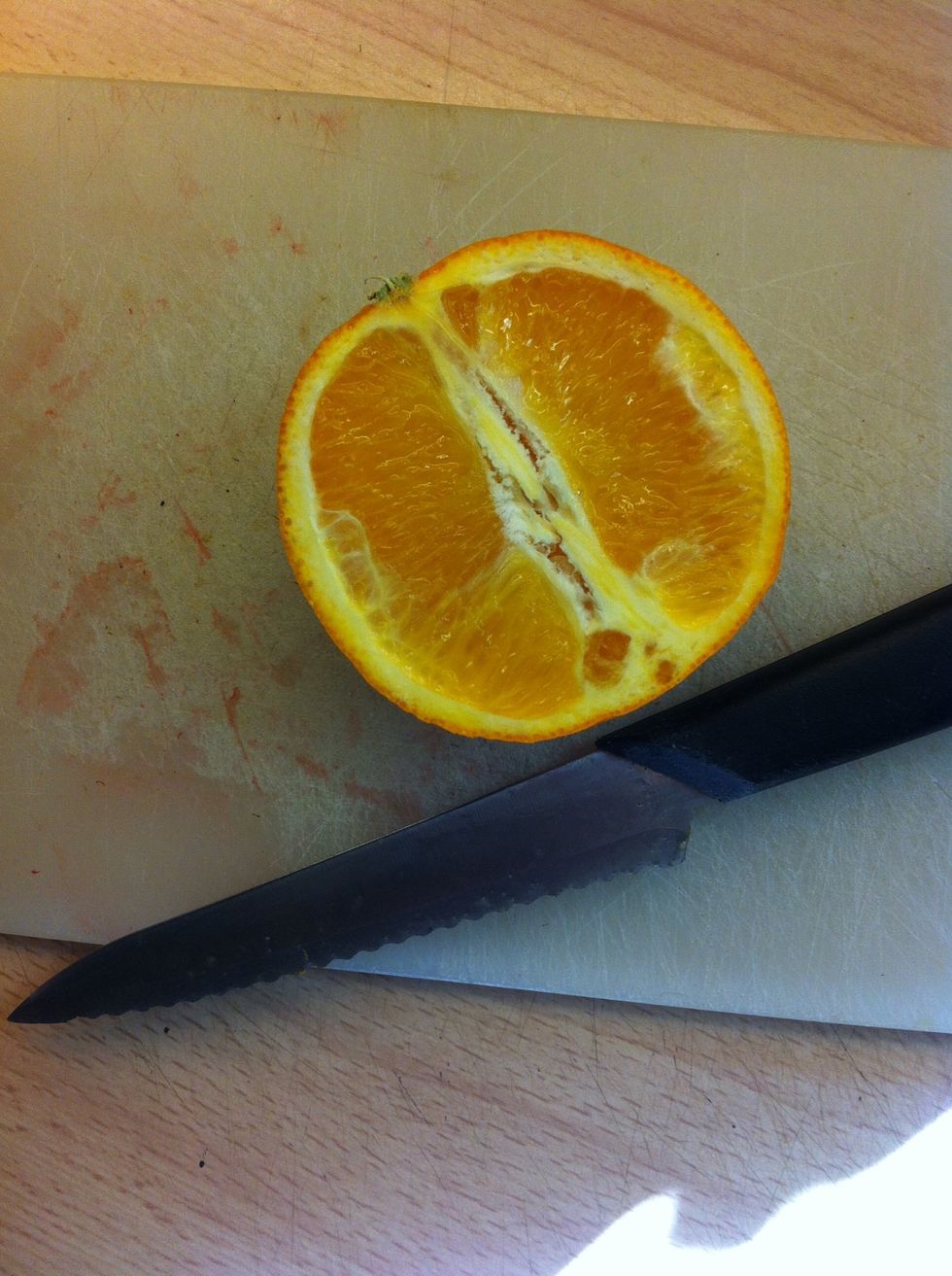 Step 3: Cut the orange ( You only need the Half orange )