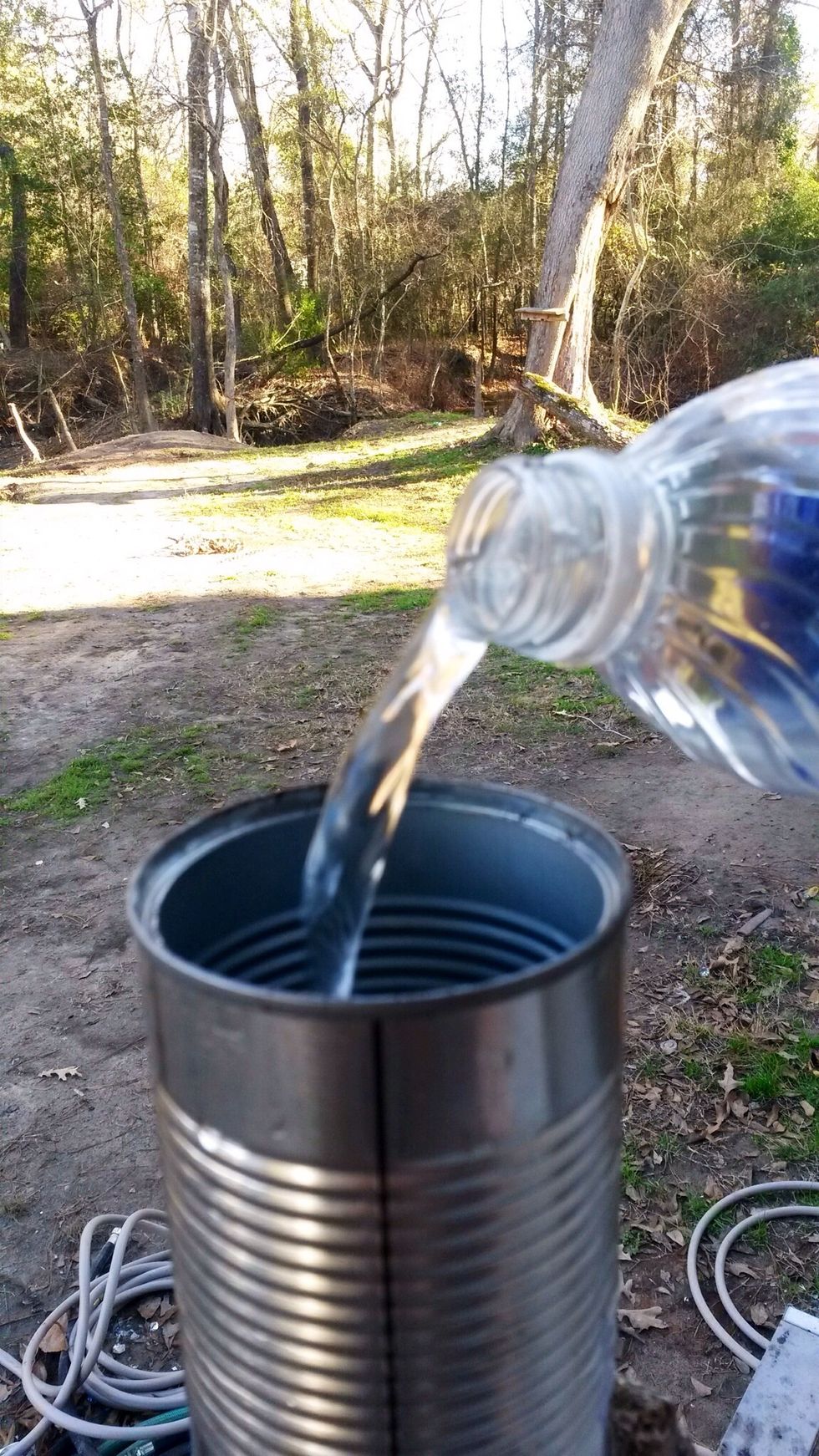 Step 3: Fill your can all the way up with water & stick it in the freezer. (You have to freeze the can so it doesn't dent when you hammer it.)