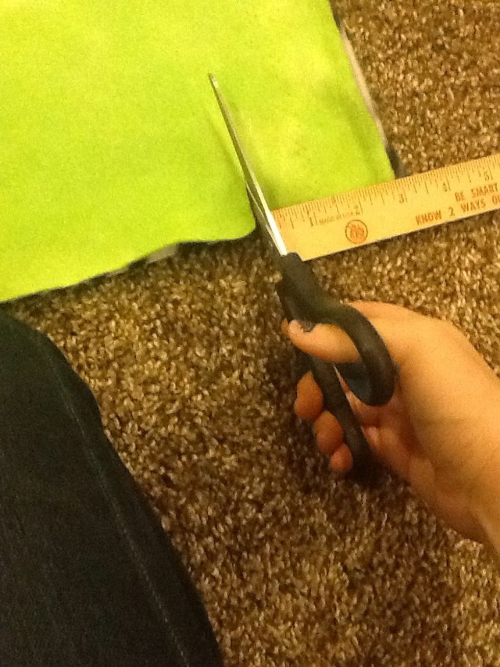 Step 3- Go 3inches into the blanket on your corner. And make a little cut with your scissors.