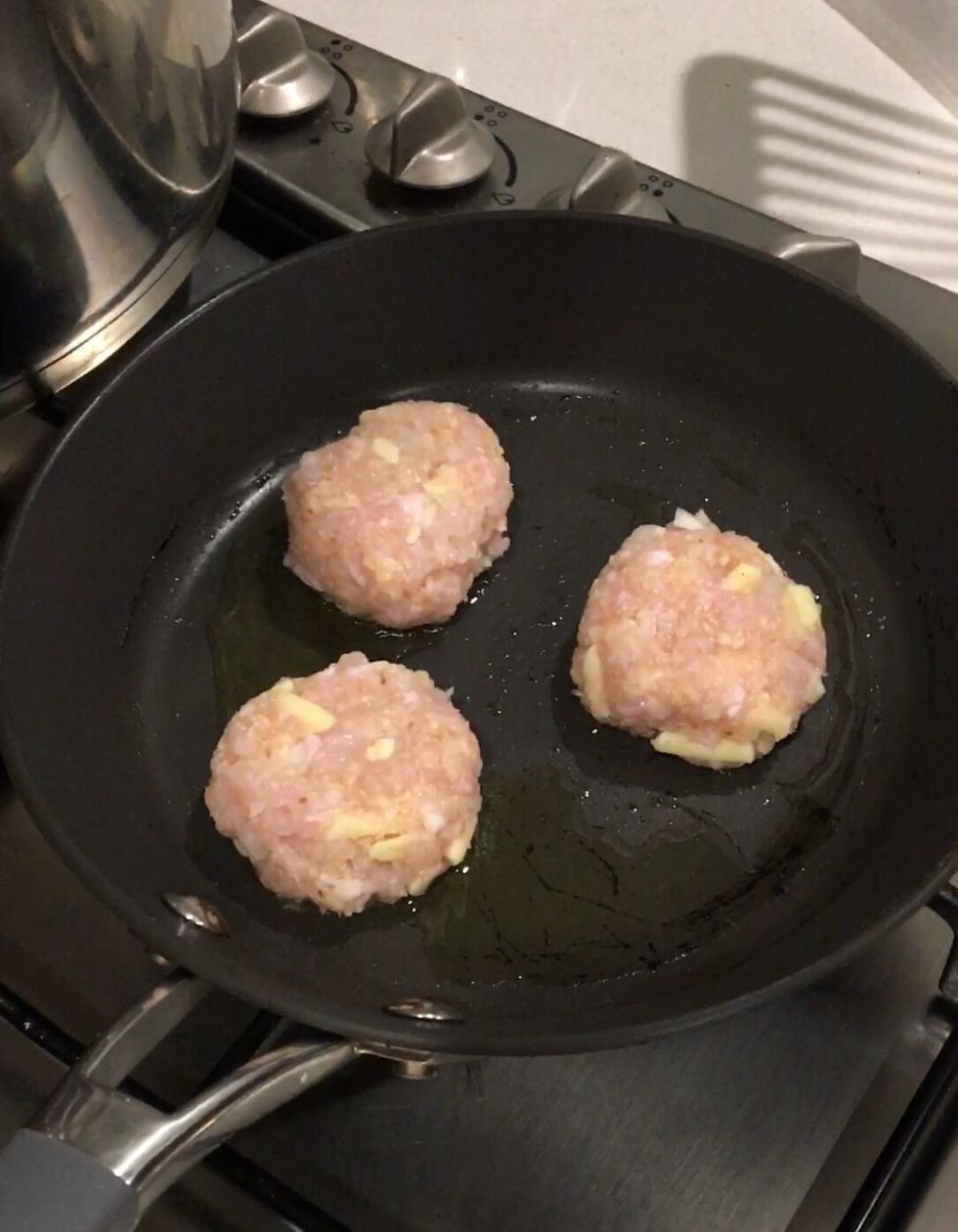 Step 3: Heat oil in a large non-stick frying pan over medium-high heat. Cook patties for 3-4 minutes each side or until browned and cooked through.