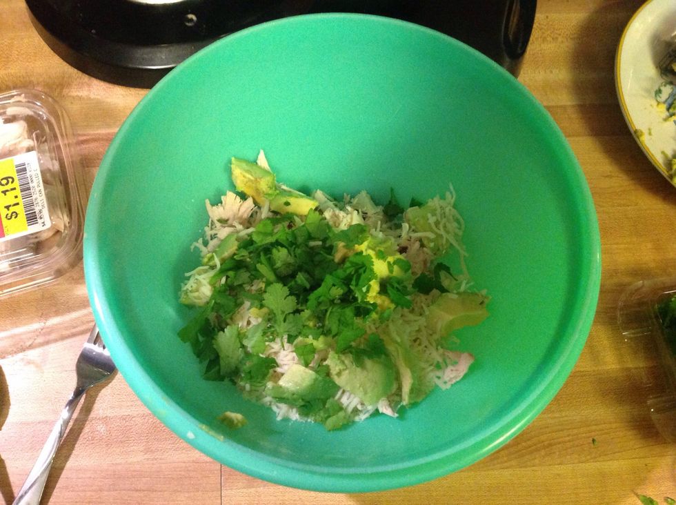 Step 3: Mix together chicken, cheese, avocado and cilantro