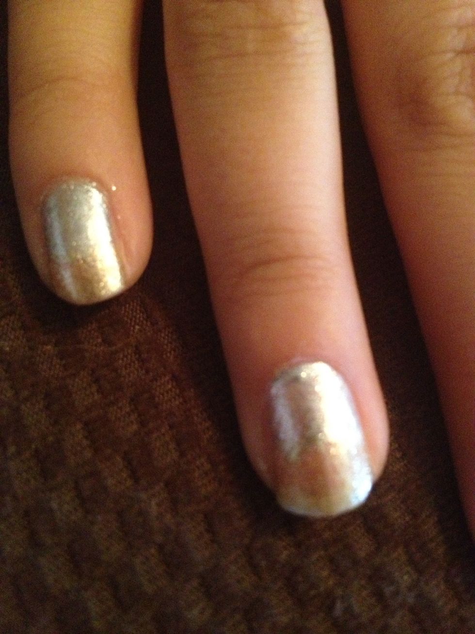 Step 3: Paint top half of nail with gold nail polish