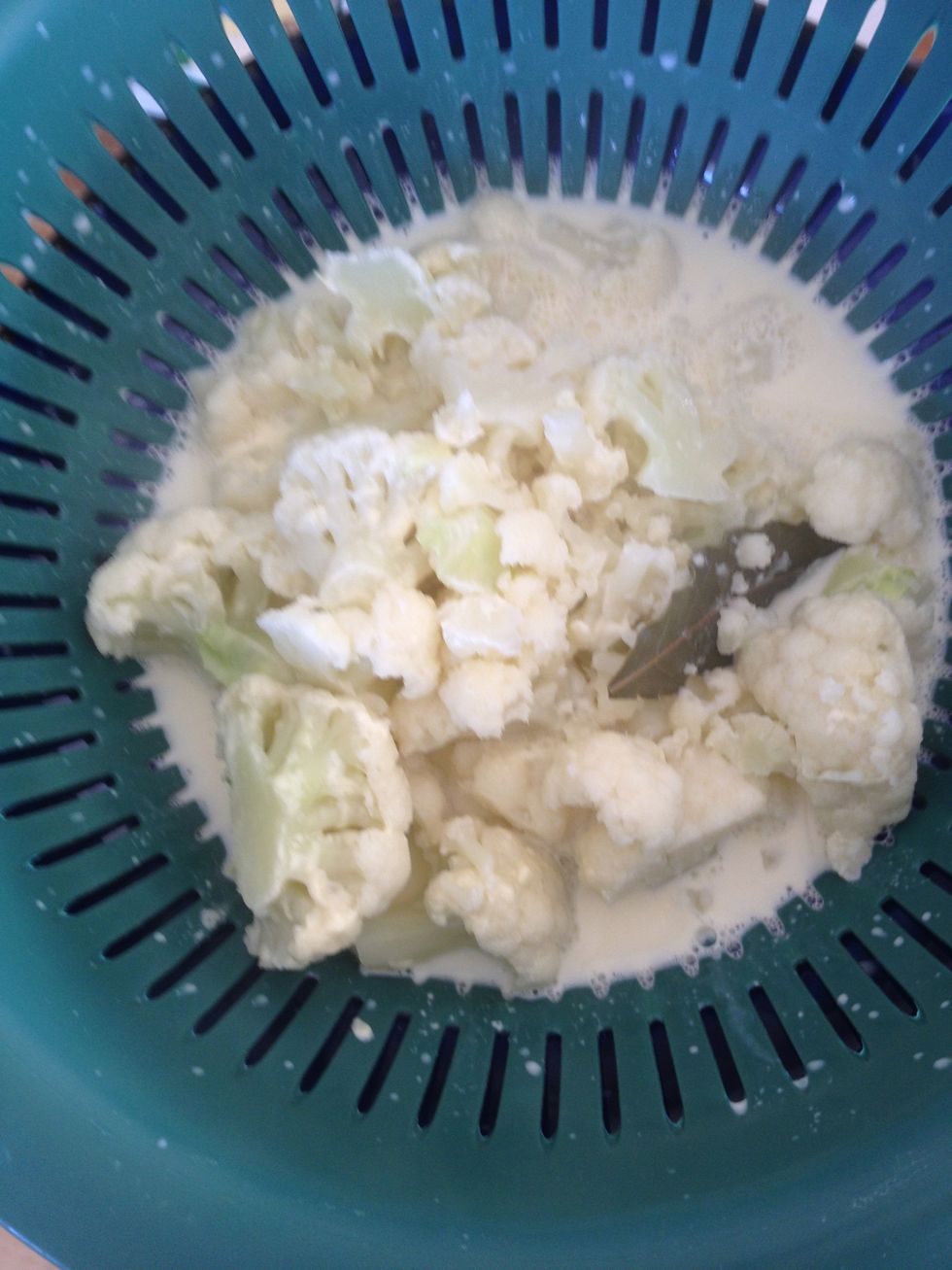 Step 3. Place the cauliflower and the milk in a strainer. Making sure to keep them separate. Remove the bay leaf