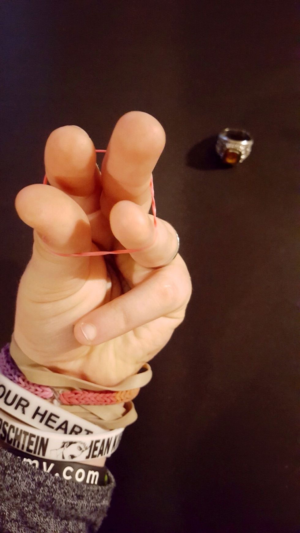 Step 3: Put 1 of 1st color of four fingers. (Excluding pinky)