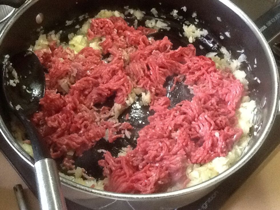 Step 3: Put the minced meat into the pan and separate any large chunks of meat.