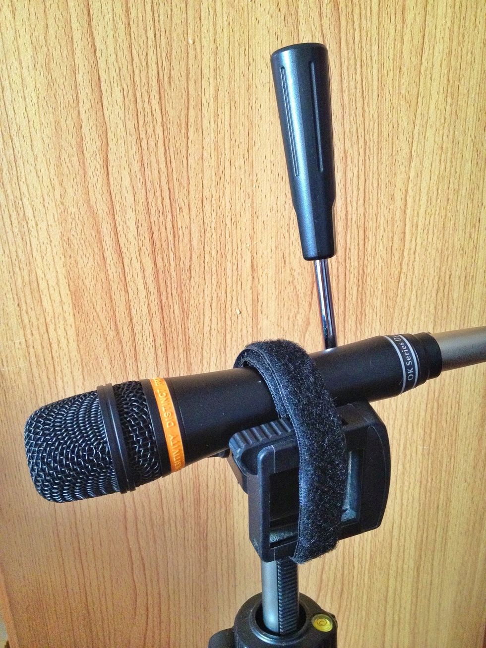 Step 3: Secure with a velcro tape thing. Then adjust the height of the tripod and you're now ready to rock and roll!