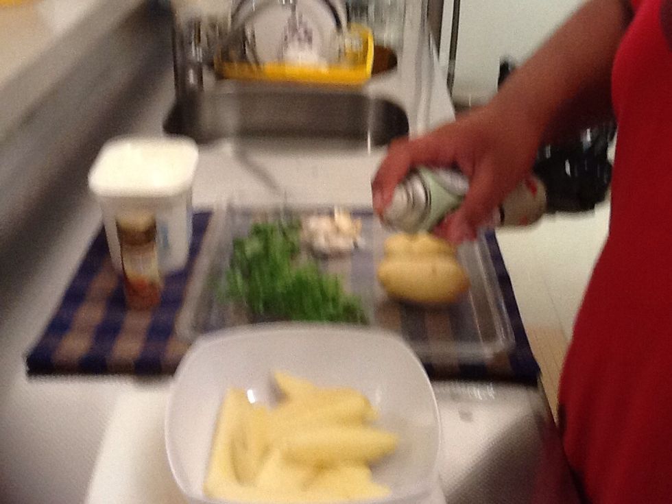 Step 3. Spray potatoes lightly with olive or canola oil spray