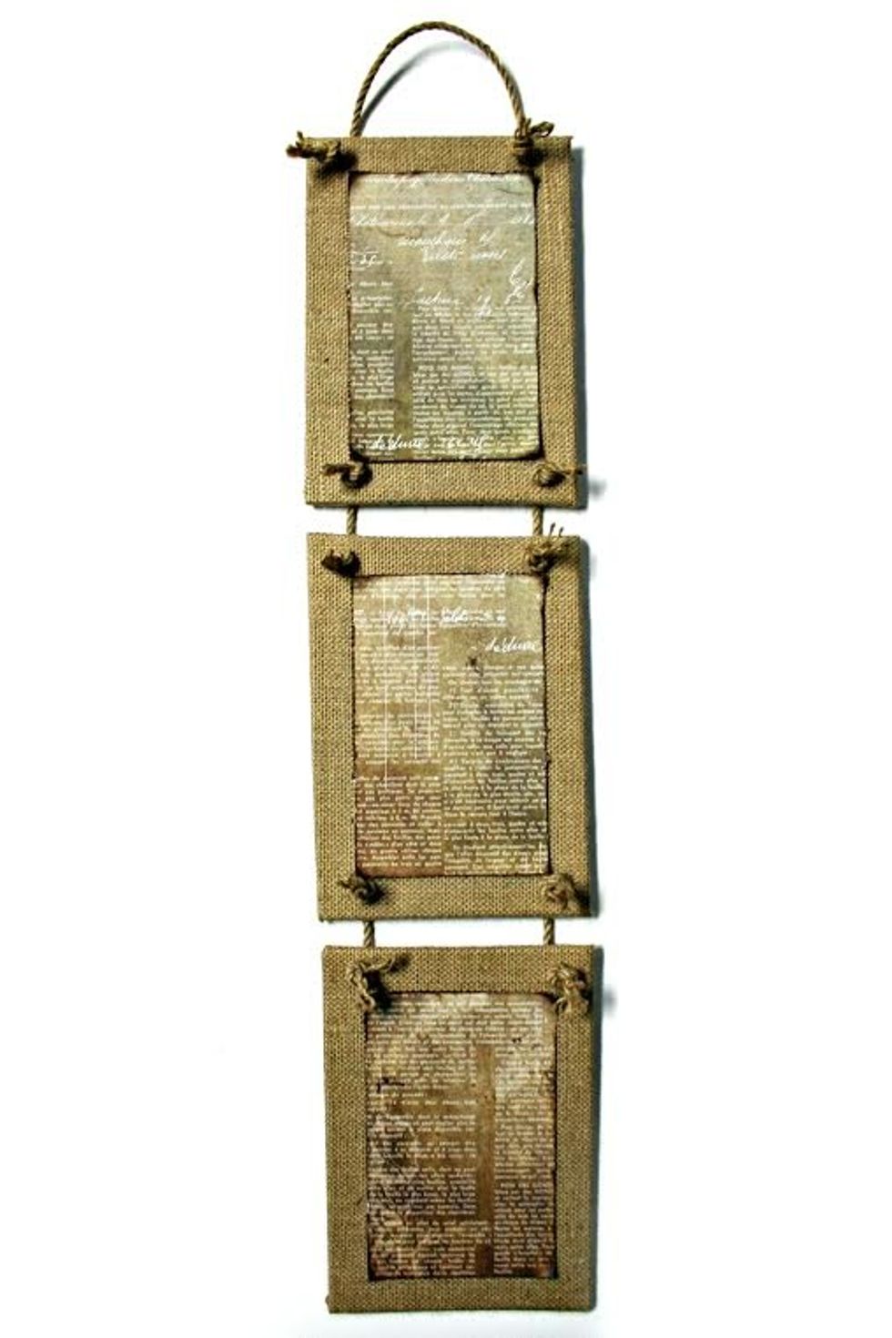 Step 3: Use a heavy-duty punch to punch holes in burlap canvases. Attach together with rope trim as shown. Cut three 3.5" x 5" rectangles from paper and adhere to the center of each canvas.