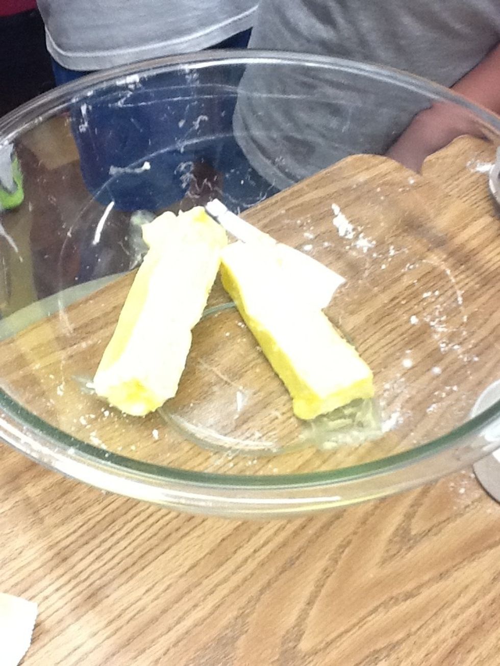 Step 3 Using a different bowl, add 2 sticks of butter.