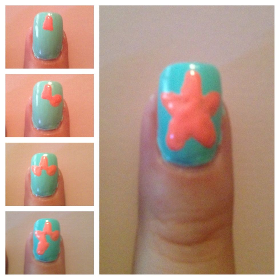 Step 3: Using Reign in Spain nail polish and dotter tool, create a starfish by making five small triangles and filling in the middle.