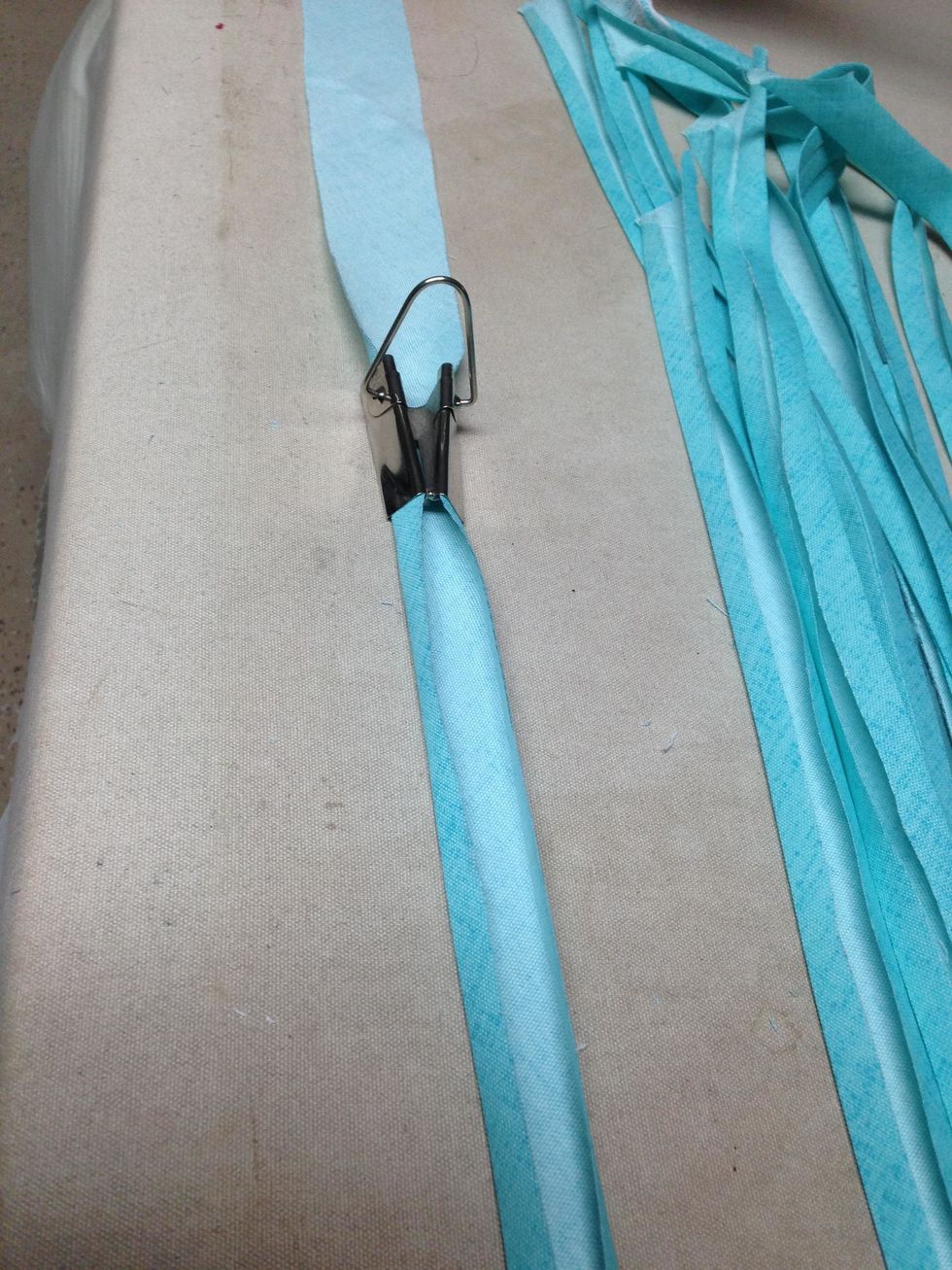 Step 3:  Using the 1\u201d Bias Tape Maker, pull each strip through the tape maker tool.  You will need 2 \u2013 28\u201d strips, 2 \u2013 15\u201d strips, 3 \u2013 11\u201d strips and 1 \u2013 6\u201d strip for EACH placemat you plan to make.