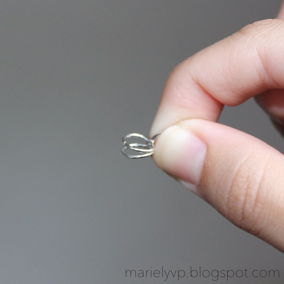 Step 3: you will now have four jump rings. Grab two of them keeping the other two open.