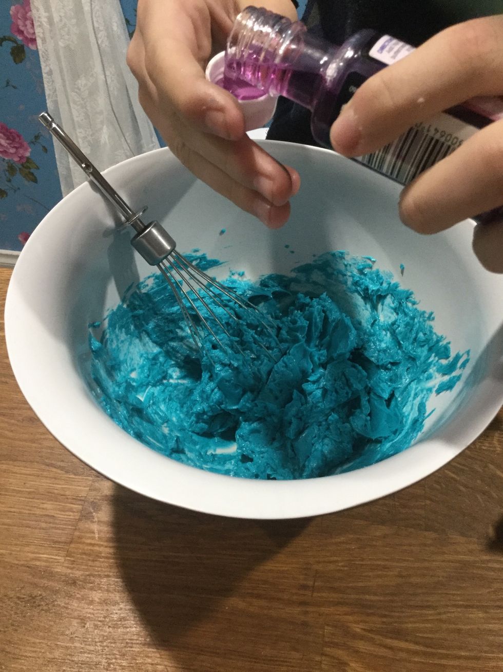 Step 33: Pour in 1 tea spoon of cotton candy flavour. Gradually put it in and each time you do that scoop up a little by of the cream to see if I needs more or if it\u2019s good.