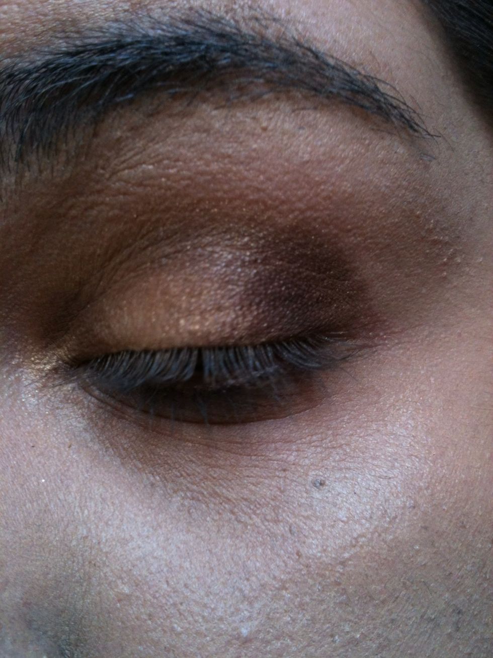 Step 4- Apply a deep purply brown shade on you outer corner.