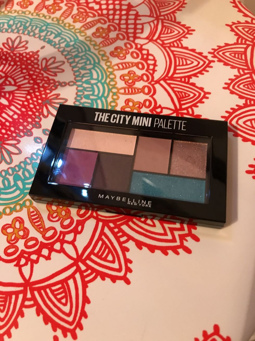 Step 4 Apply a medium-dark shade of the purple eyeshadow in the pack to each eye