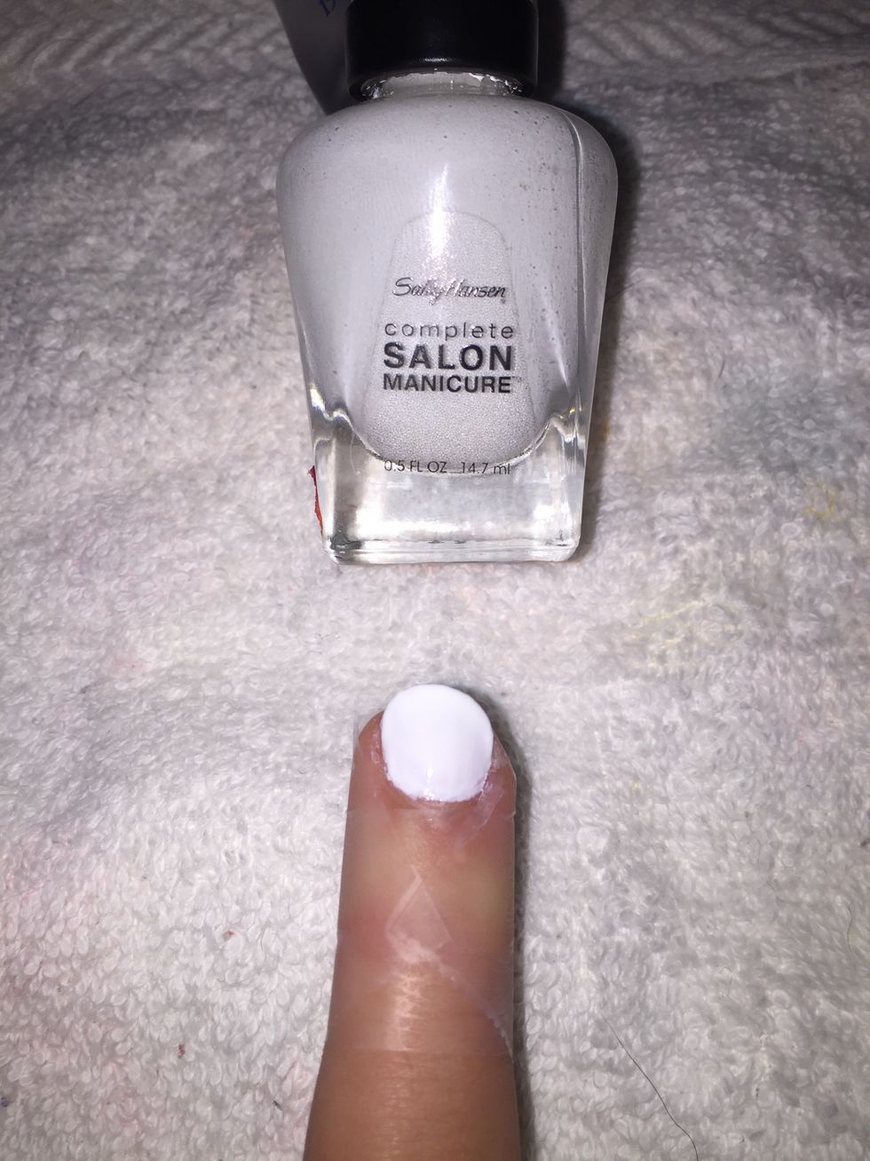 Step 4: Apply white nail polish.