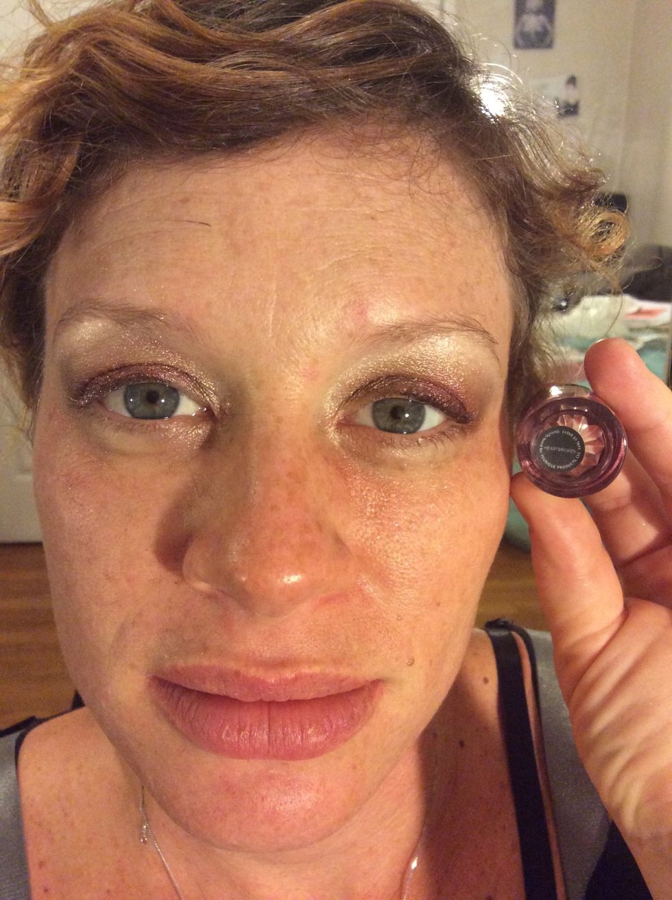 Step 4: Apply Younique's shimmer pigment Heartbroken mixed with Younique's Rose Water to the outer corner of your lids and blend it toward the center