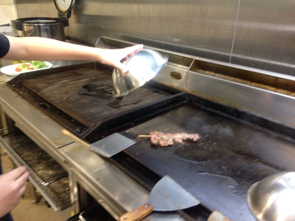 Step 4: Cover lamb skewer with stainless steel bowl. The purpose of this is to help it cook evenly and quickly with out losing the juices. Leave bowl for about 5 - 7 minutes, or cook to your liking.
