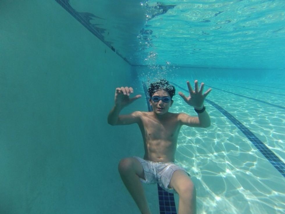 Step 4: Get comfortable going underwater in the pool. Hold your breath and exhale through your nose to prevent water from getting in your nose. Goggles let your eyes see the air bubbles you blow.