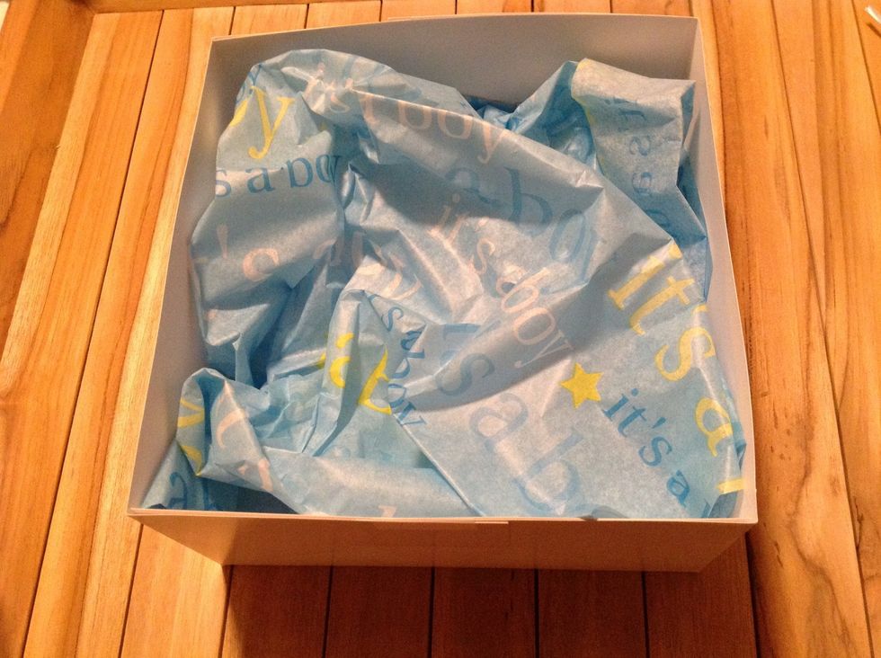 Step 4: Place a few tissue papers in the bottom of the cake box ...