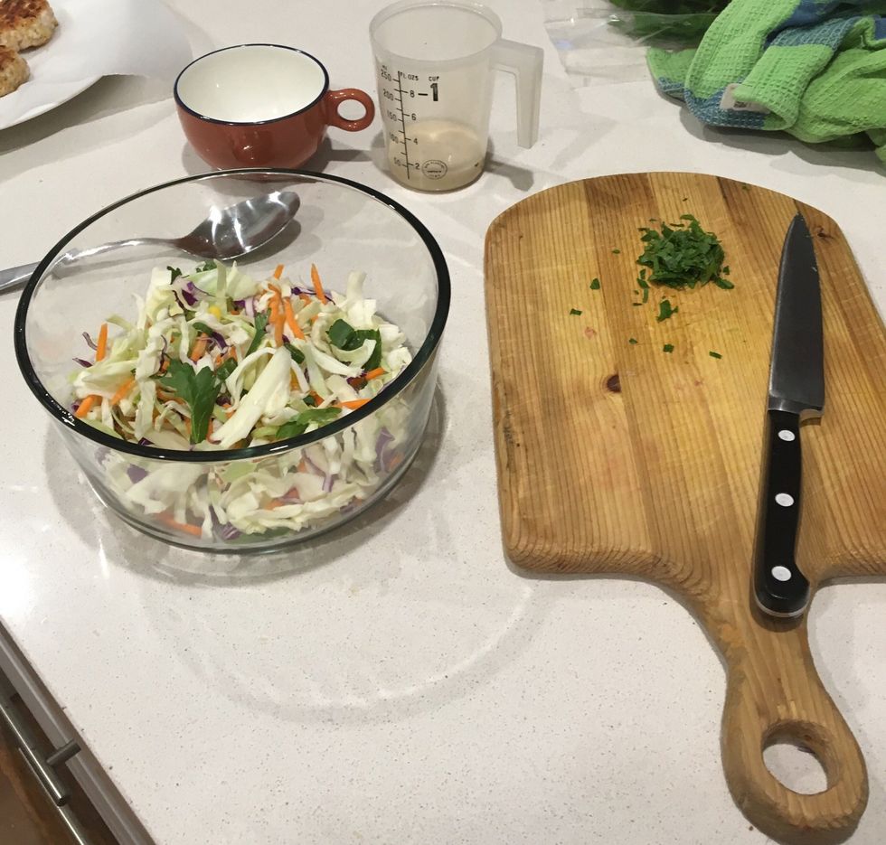 Step 4: place coleslaw, parsley, dressing and 1 tablespoon water in a medium bowl. Toss gently to combine.