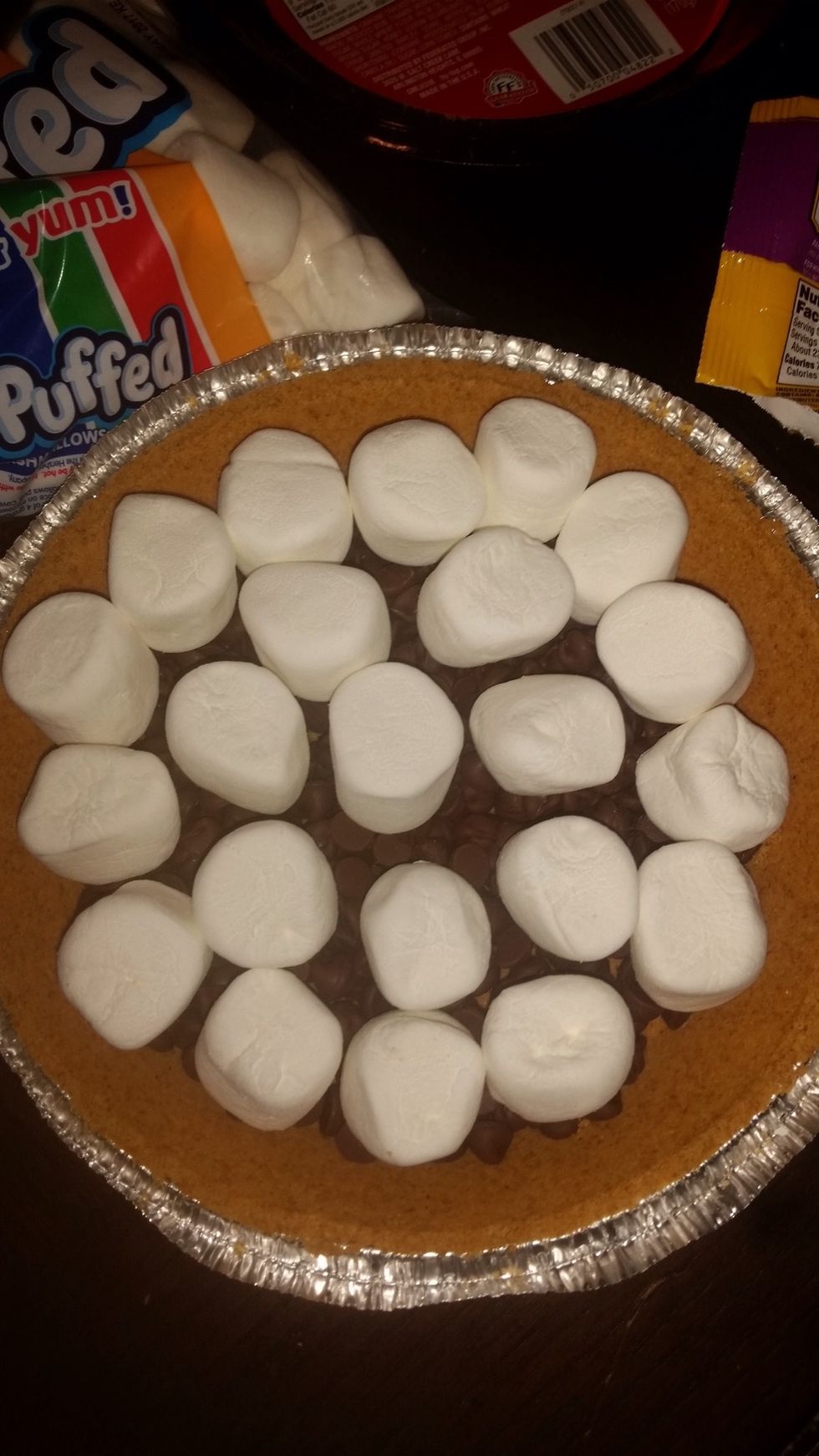 Step 4: Place marshmallows on top of the baking chips .