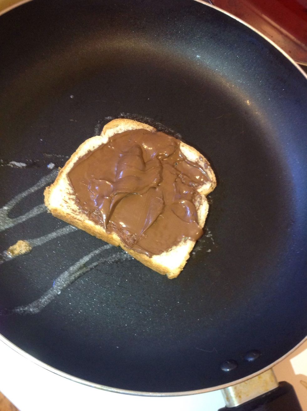 Step 4: place the bread slice with the Nutella side up onto your pan/skillet and let it brown for a few minutes. (Or to your liking)