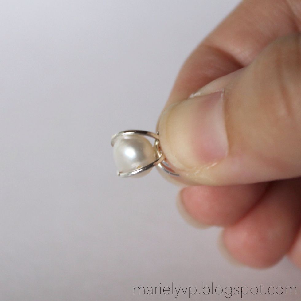 Step 4: place the pearl inside of those two jump rings you were keeping open.