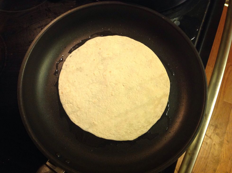 Step 4: Place tortilla in the pan