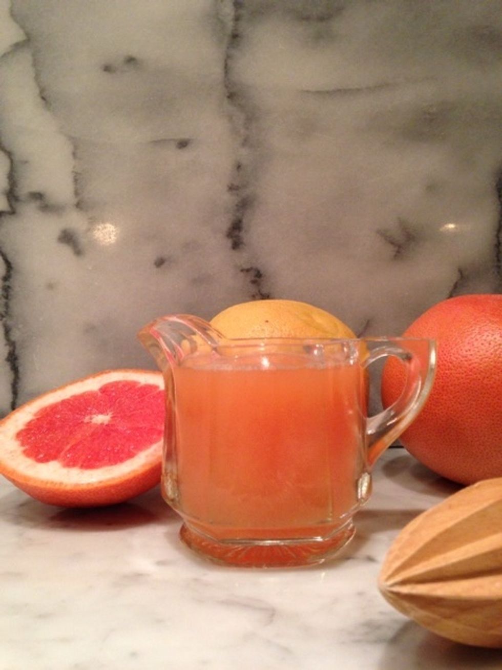 Step 4: prepare fresh squeezed grapefruit juice. For one drink, you won't need much. Pour the juice over the ingredients already in your cocktail glass . You should just about fill the glass up.