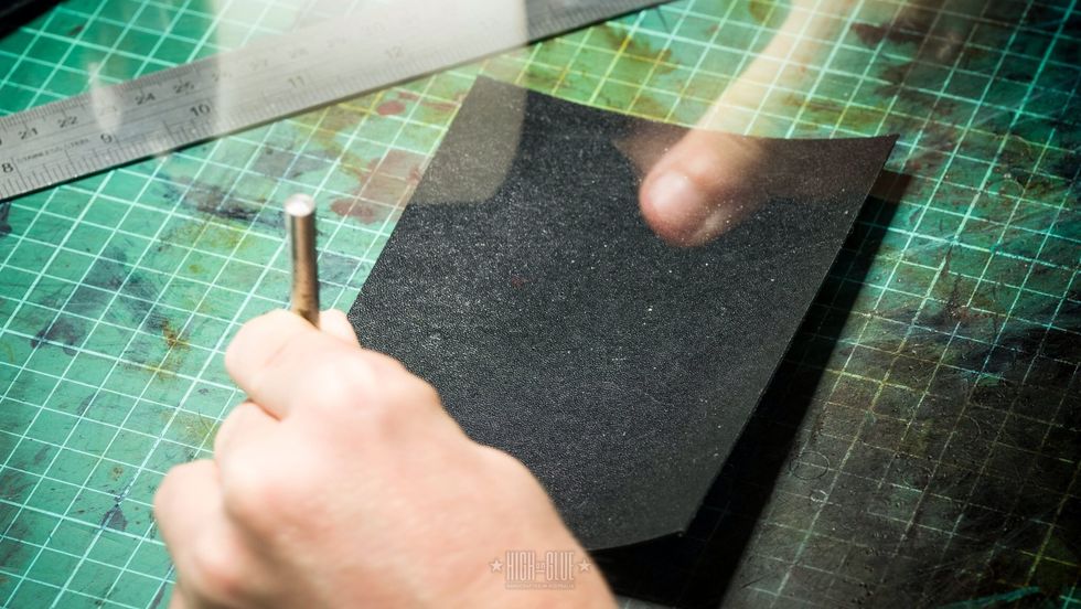 Step 4: punch holes - Use a 3mm hole punch and mallet (or a rotary punch) and add the 8 holes needed for the credit card slots. Connect the holes by cutting between them.