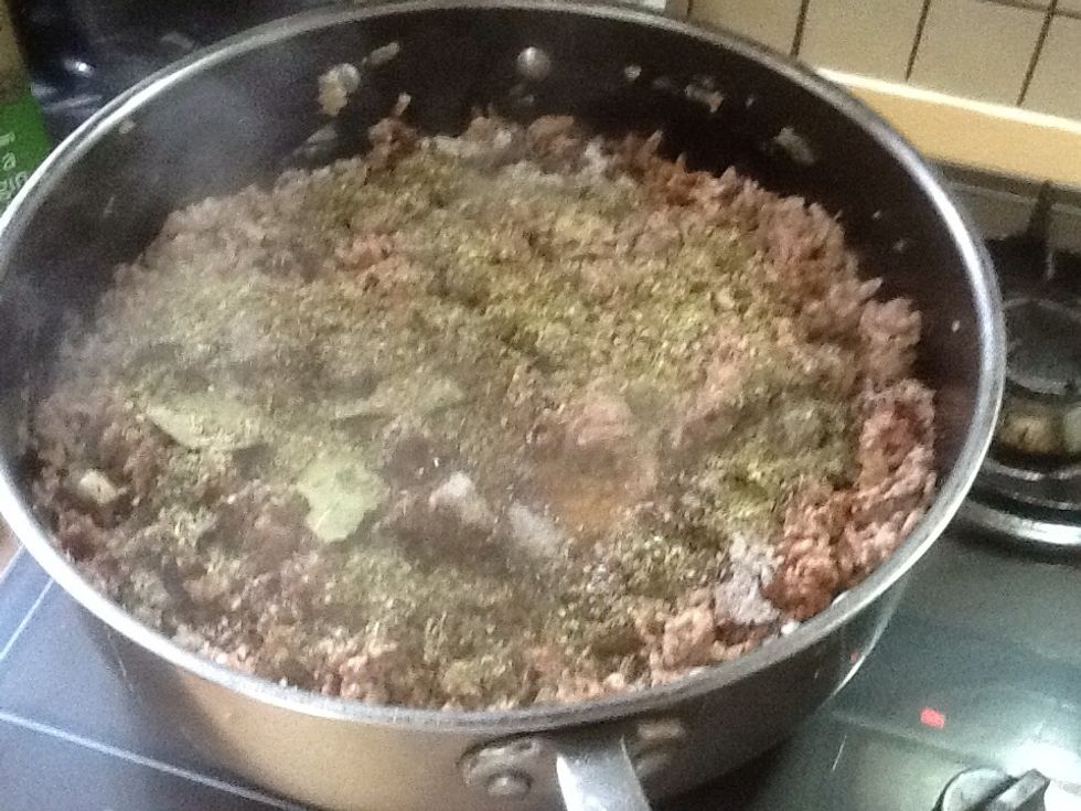 Step 4: Put your bay leaves and oregano into the pan with your cooking ingredients.