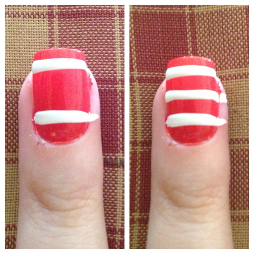Step 4 (Ring Finger): Create three thin lines across nail with white acrylic paint and nail art stripper brush