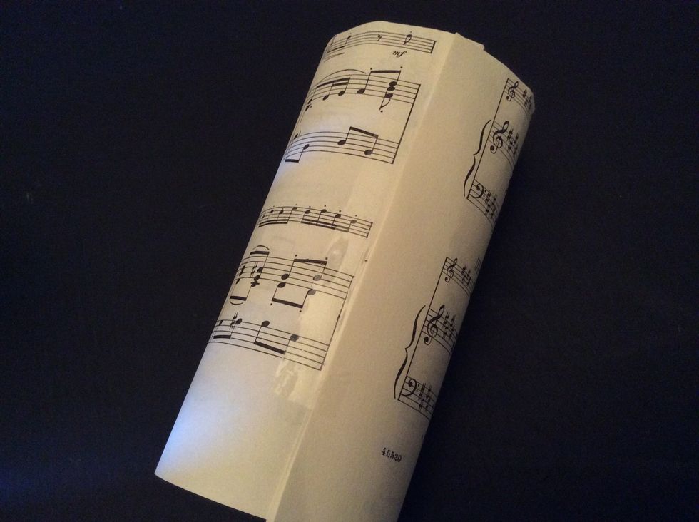 Step 4- roll paper and tape edges together.