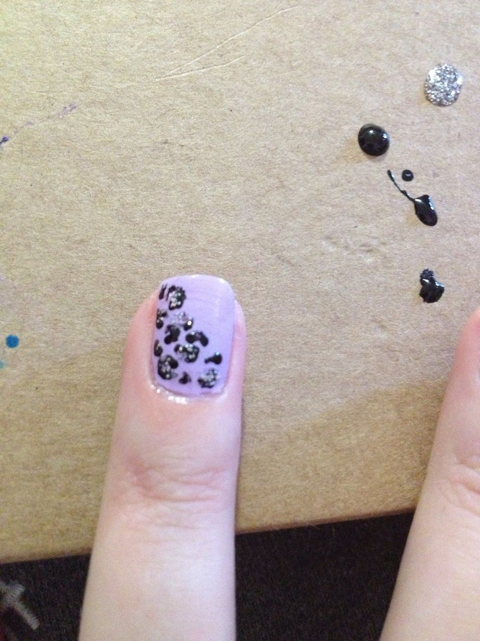 Step 4: Using dotting tool and glitter nail polish to put glitter in middle of cheetah spots. I used Queen of Beauty by Sinful Colors
