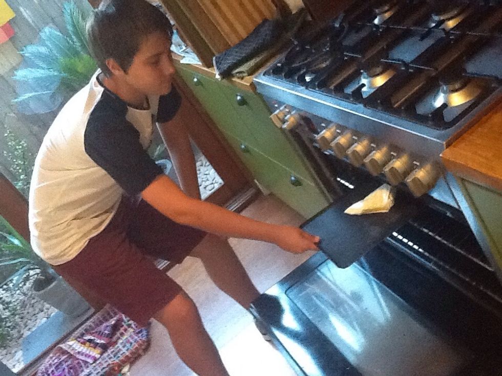 Step 4b) repeat step 4 to make more triangles. Then put them on the baking tray and slide it into the oven for about 20-25 minutes