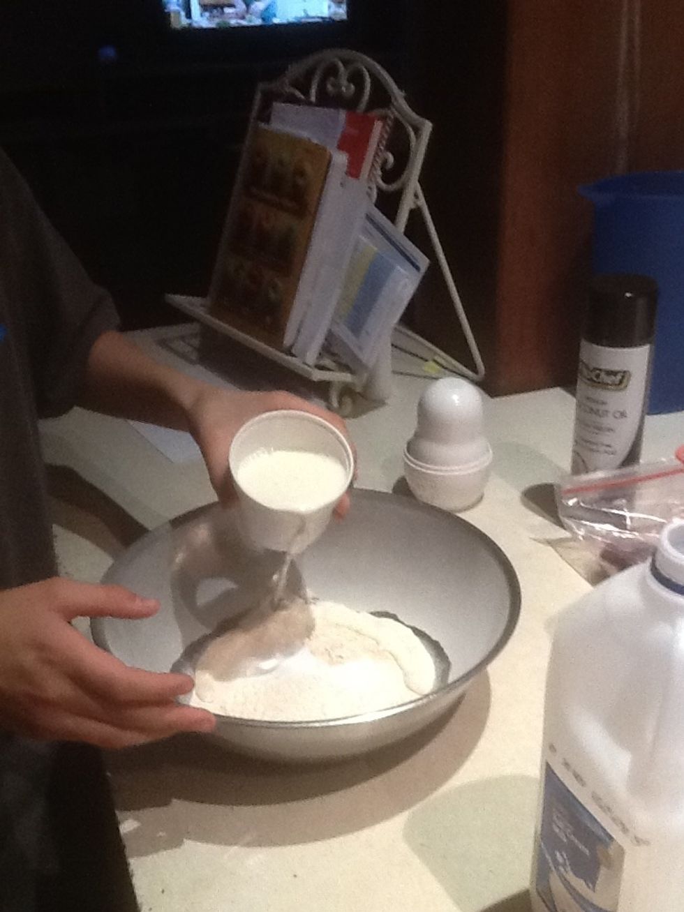 Step 5: Add 1 cup of milk and half a cup of low fat milk to the bowl.