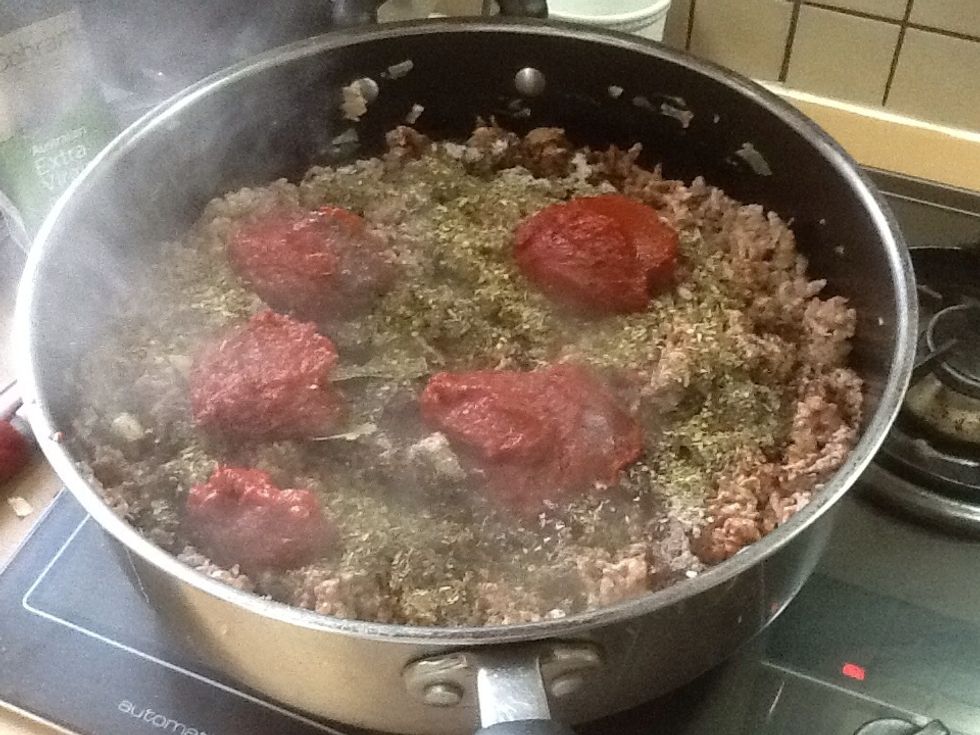 Step 5: add 4 large spoons of tomato paste.