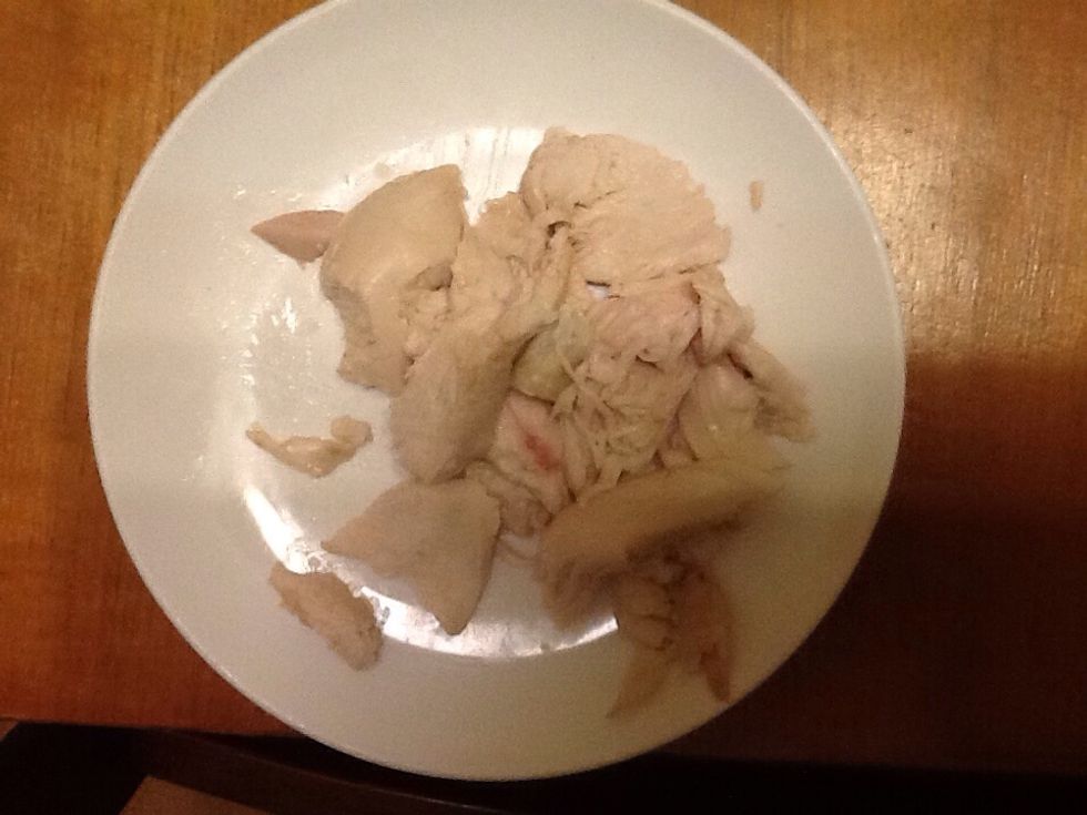 Step 5. Add your filling to your rice paper roll. My filling is chicken but you can use what ever you want. Place it so it looks like a sausage in the middle of the sheet towards the bottom.