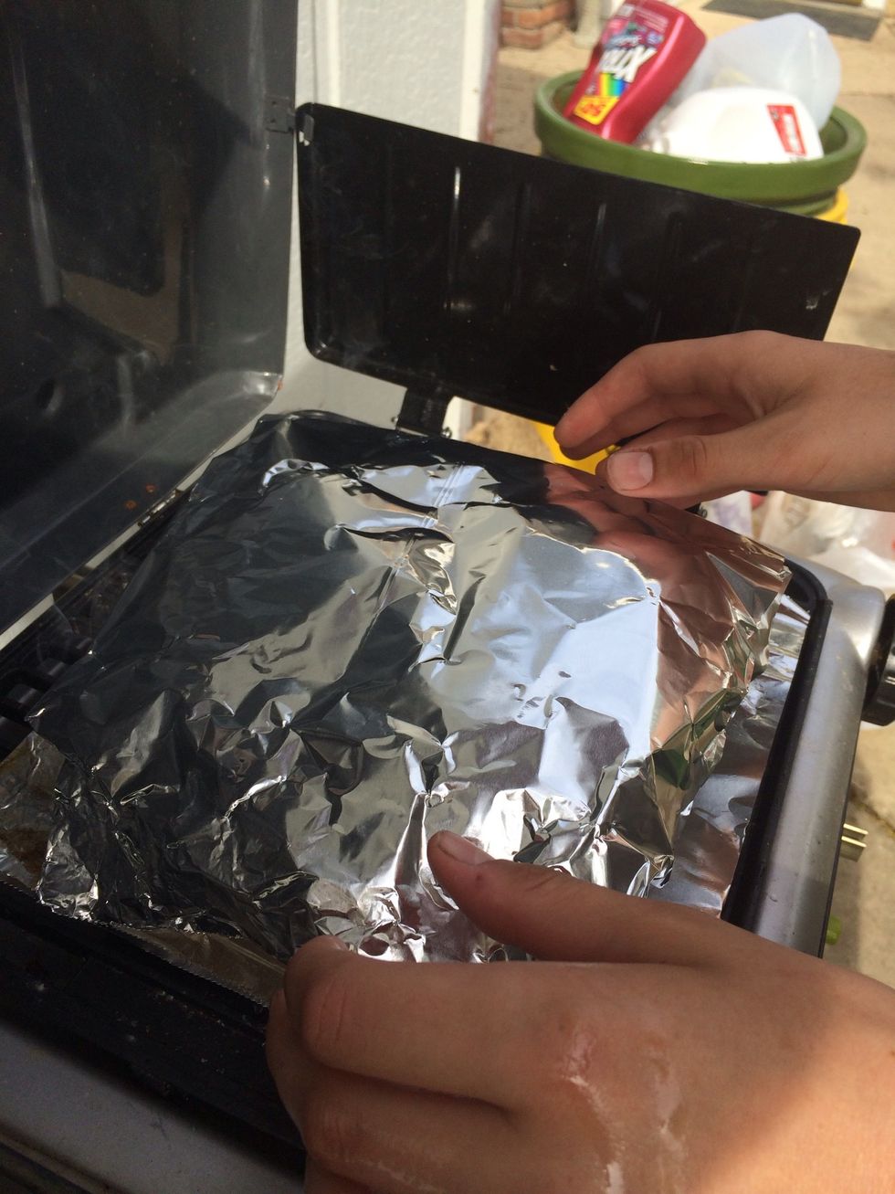 Step 5: Cover fish with another peace of foil and cook until fat starts to come out