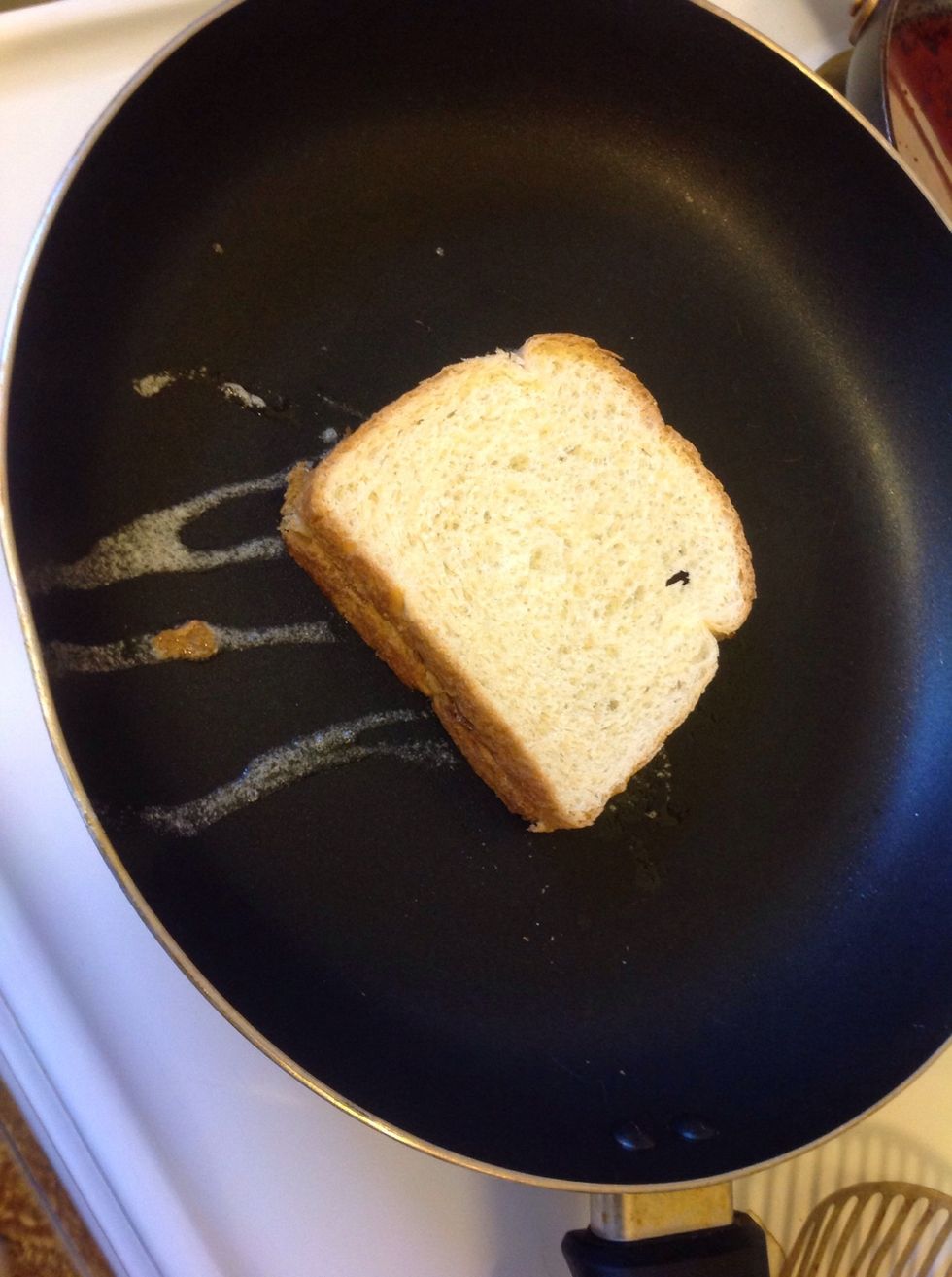 Step 5: now place the second slice onto the the previous slice just like a grilled cheese and flip the sandwich over with your spatula.