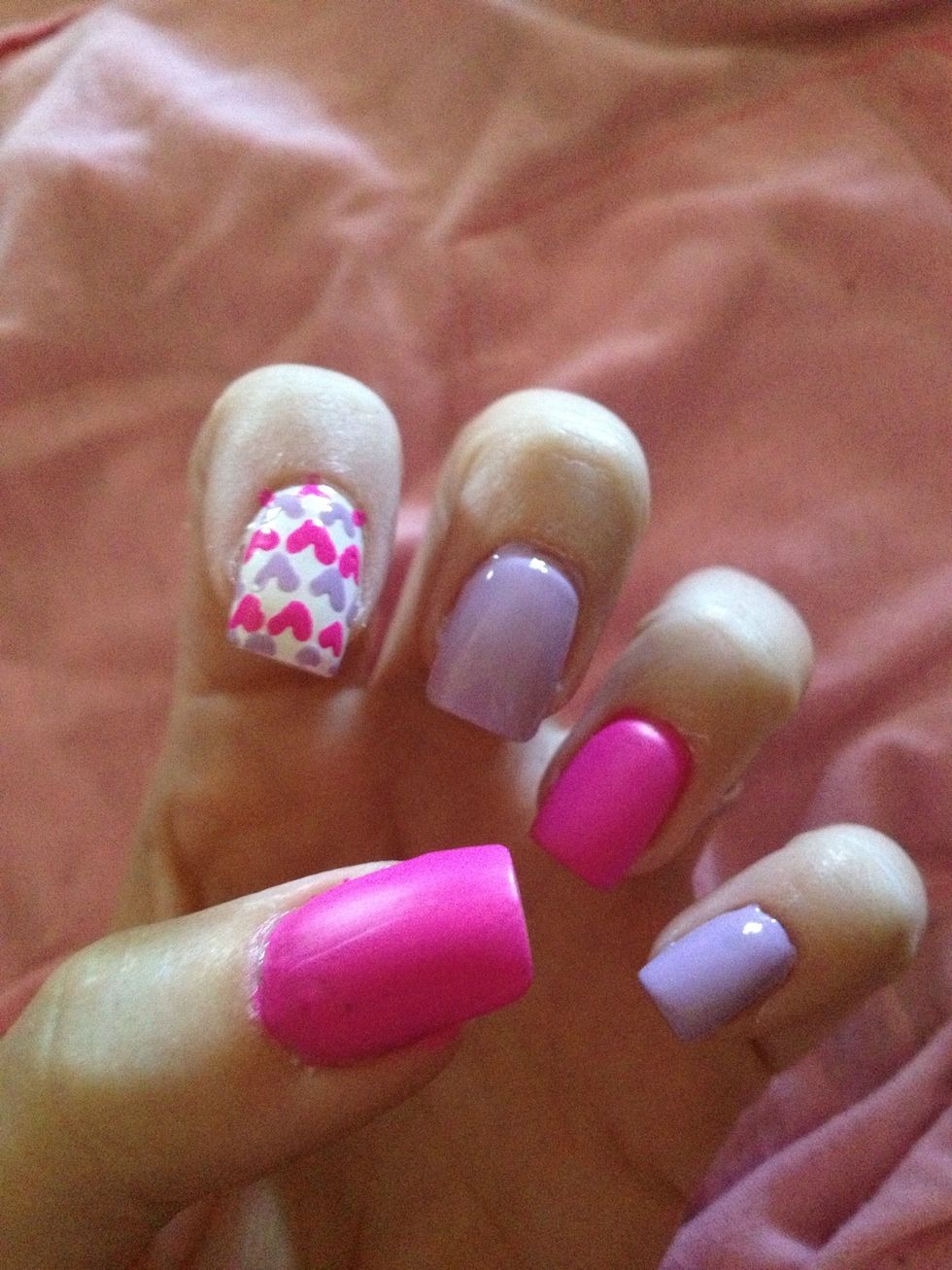 Step 5: Paint two coats of Purple nail polish on pinkie and middle fingers. Do not let dry completely.