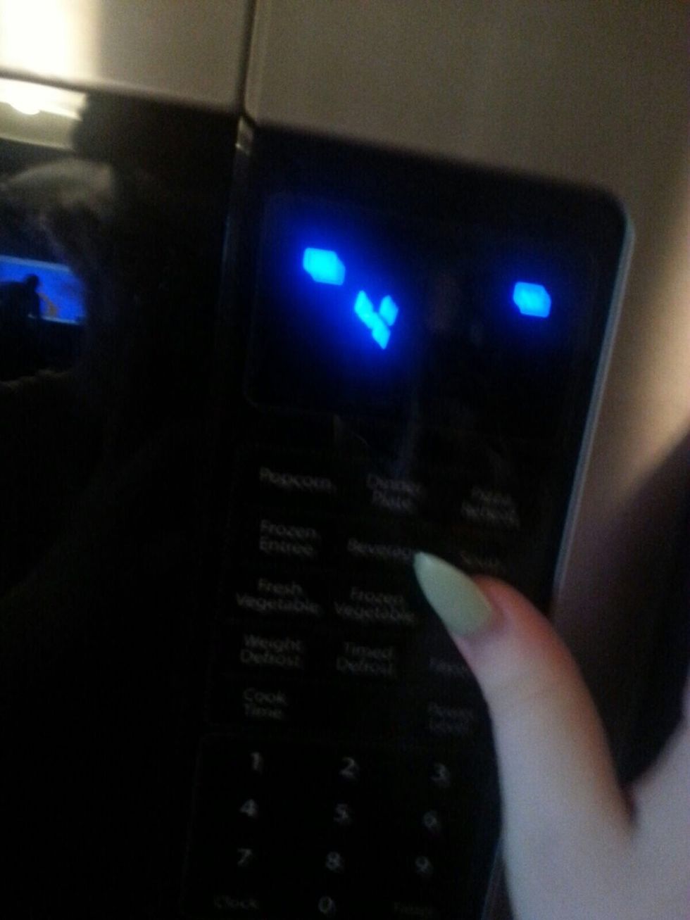 Step 5: put the cover on and place it in the microwave, pressing the 'Potato' button 4 times