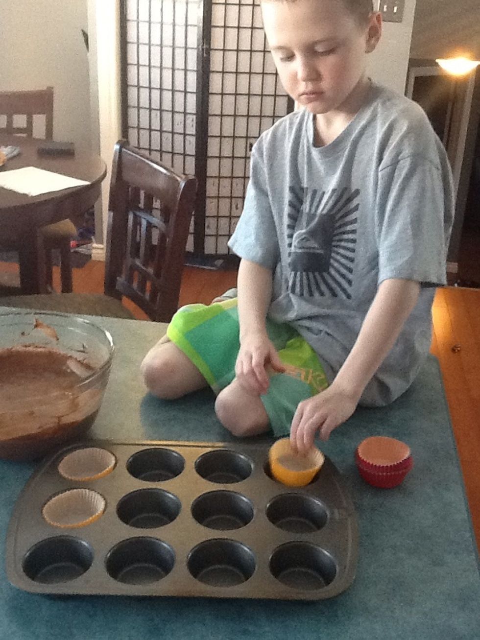 Step 5. Put the cupcake liners into the cupcake tin.