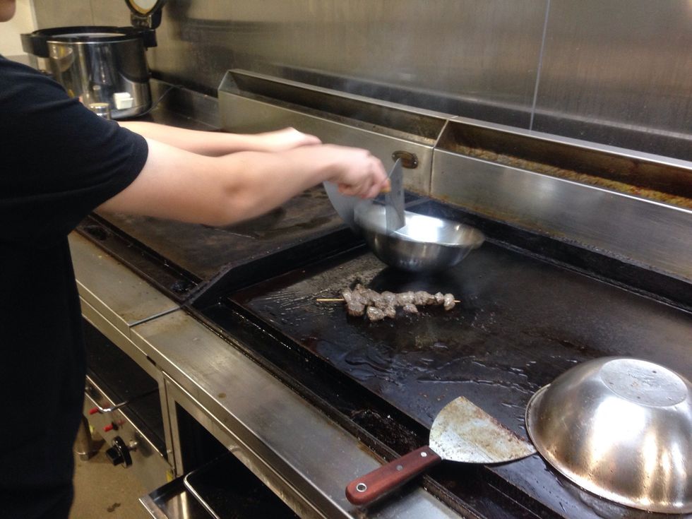 Step 5: Take off stainless steel bowl and leave the lamb skewer for 2 - 3 minutes more to chargrill.