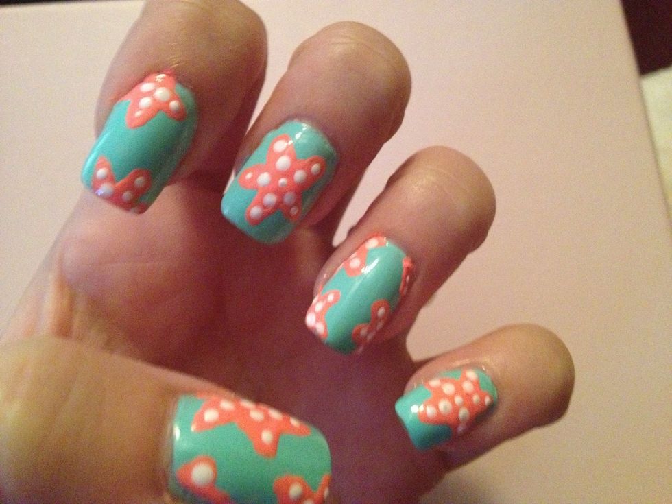 Step 5: Use dotting tool and white nail polish to create small dots inside of your starfish