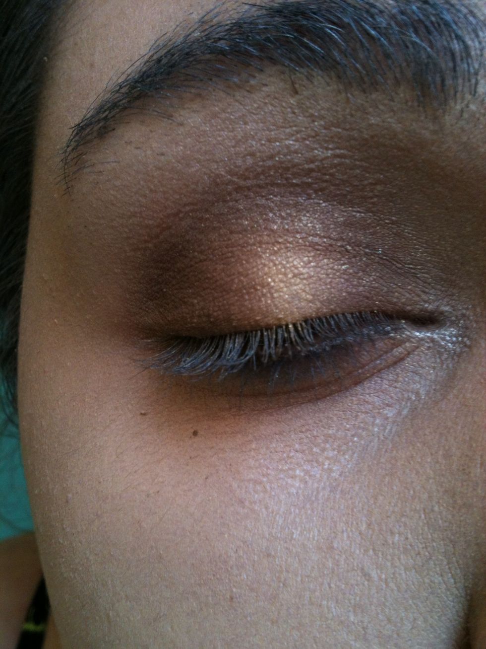 Step 6- Apply a champagne shade on your brow bone and in your inner corner, and then you're done!