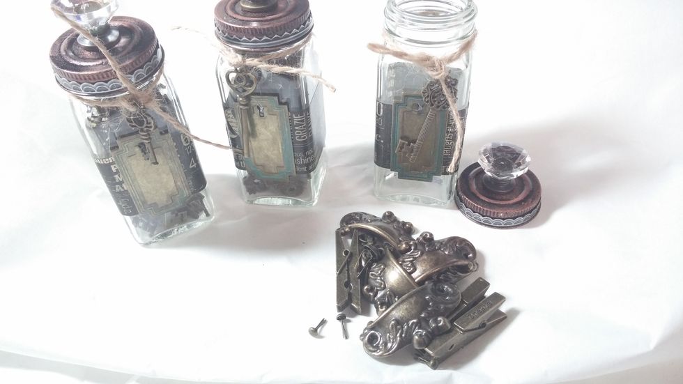 Step 6: Find some embellishments with similar finishes to display proudly in your new alterd jars.
