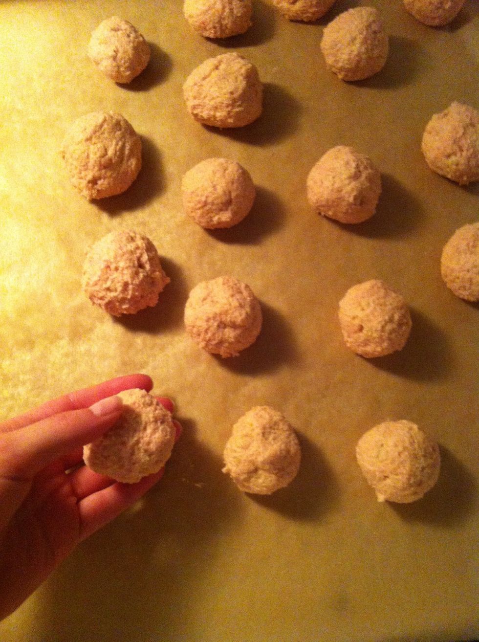 Step 6: Form cake balls, the size of a golf ball and put them on a waxpaper lined cookie sheet.